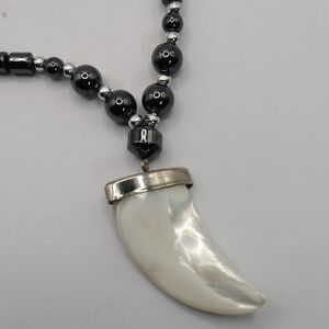 Hematite necklace Mother of pearl carved claw pendant